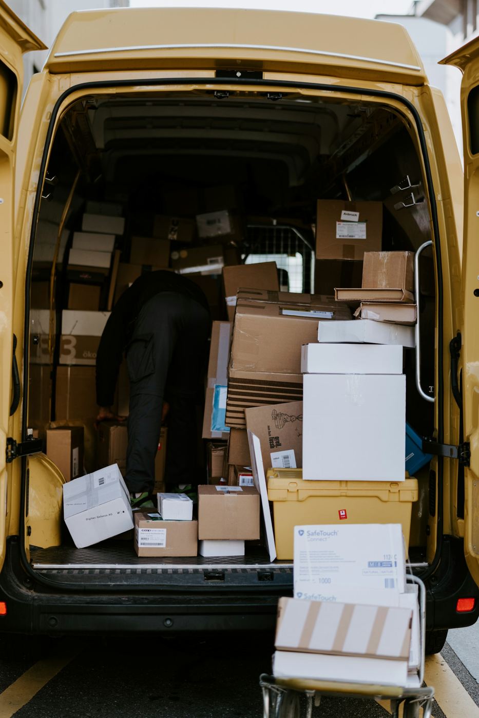 Delivery van being loaded with parcels